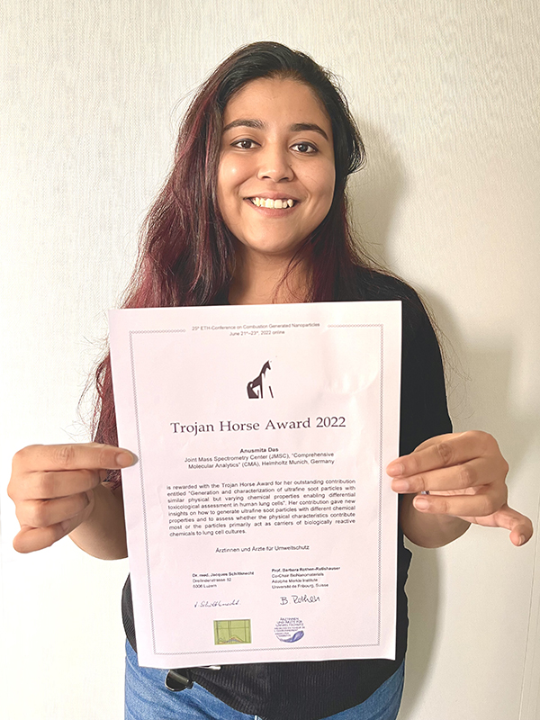 Anusmita Das with the Trojan Horse award certificate